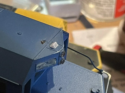 Close-up of a blue electronic device with a blurred background