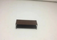 Rectangular wooden shelf on a white floor