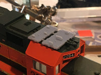 Close-up of a model train engine with a blurred background