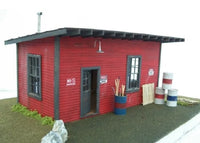 Model of a red building with various props on a white background