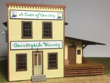 Model of a two-story building with 'A Taste of Country' and 'Countryside Winery' signs.