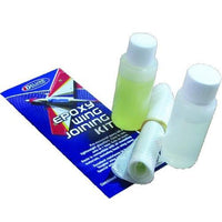 Epoxy wing joining kit with bottles and a roll of cloth on a white background