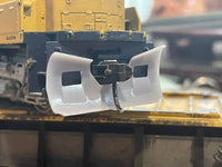 Close-up of a bulldozer blade with a blurred background
