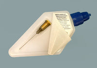 White plastic tool with blue handle and gold component on a gray background