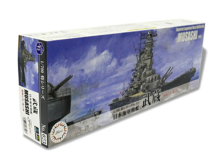 Model ship kit box for the Musashi with a blue sky and cloud background.