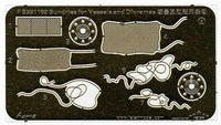 Metal template with various marine-related cutouts on a black background