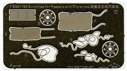 Metal template with various marine-related cutouts on a black background