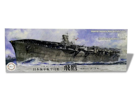 Model ship kit packaging with a detailed illustration of an aircraft carrier on a white background