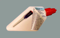 Glue applicator with needle on a gray background