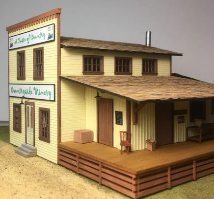 Model of a two-story building with a wooden deck and 'Countryside Winery' sign.