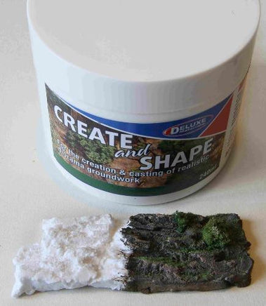 Jar of modeling clay with a sample piece on a neutral background
