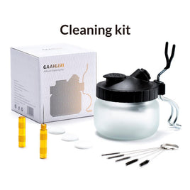 Cleaning kit with glass container, black lid, yellow vials, and packaging on a white background