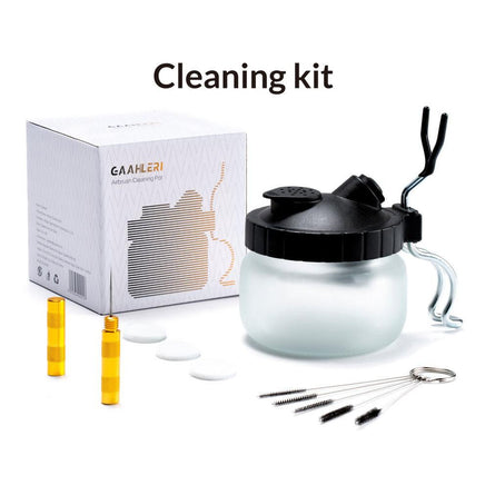 Cleaning kit with glass container, black lid, yellow vials, and packaging on a white background