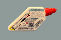 Laser-cut kit glue applicator with red cap on a gray background