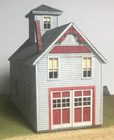 Model of a two-story building with red accents on a plain background