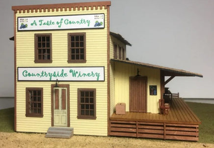 Model of a winery building with 'A Taste of Country' and 'Countryside Winery' signs.