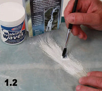 Person using a brush to apply white paint on a surface with 'Making Waves' product in the background.