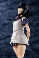 Figure of a girl in a school uniform against a dark textured background