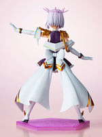 Anime character figurine with white hair and purple outfit on a pink platform against a light pink background