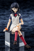 Figurine of a character in a school uniform sitting on a black cube with a dark textured background